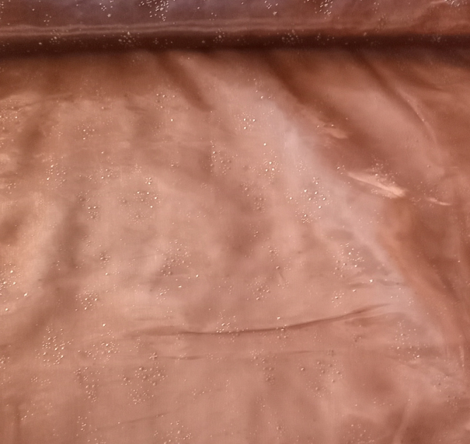Bronzefarbener Organza mit aufgedampften goldenen Sternchen 